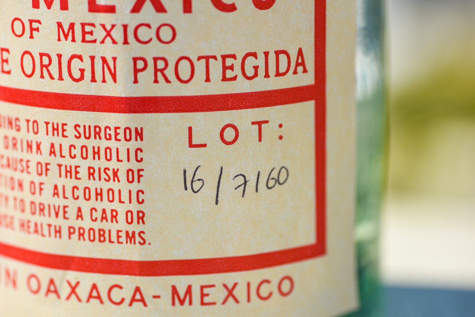 Photo by YesMore Content a close up of a bottle of alcohol