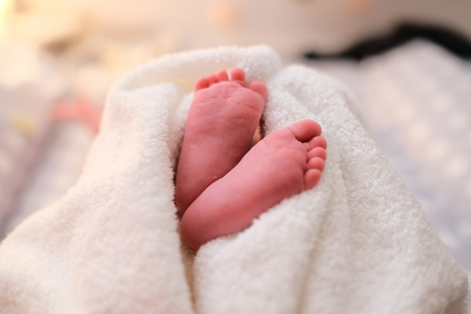 Photo by Marcel Fagin baby covered with white blanket